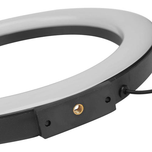 Close-up of a ring light showing the black outer frame, a brass mounting screw, and a black power cable on a white background.