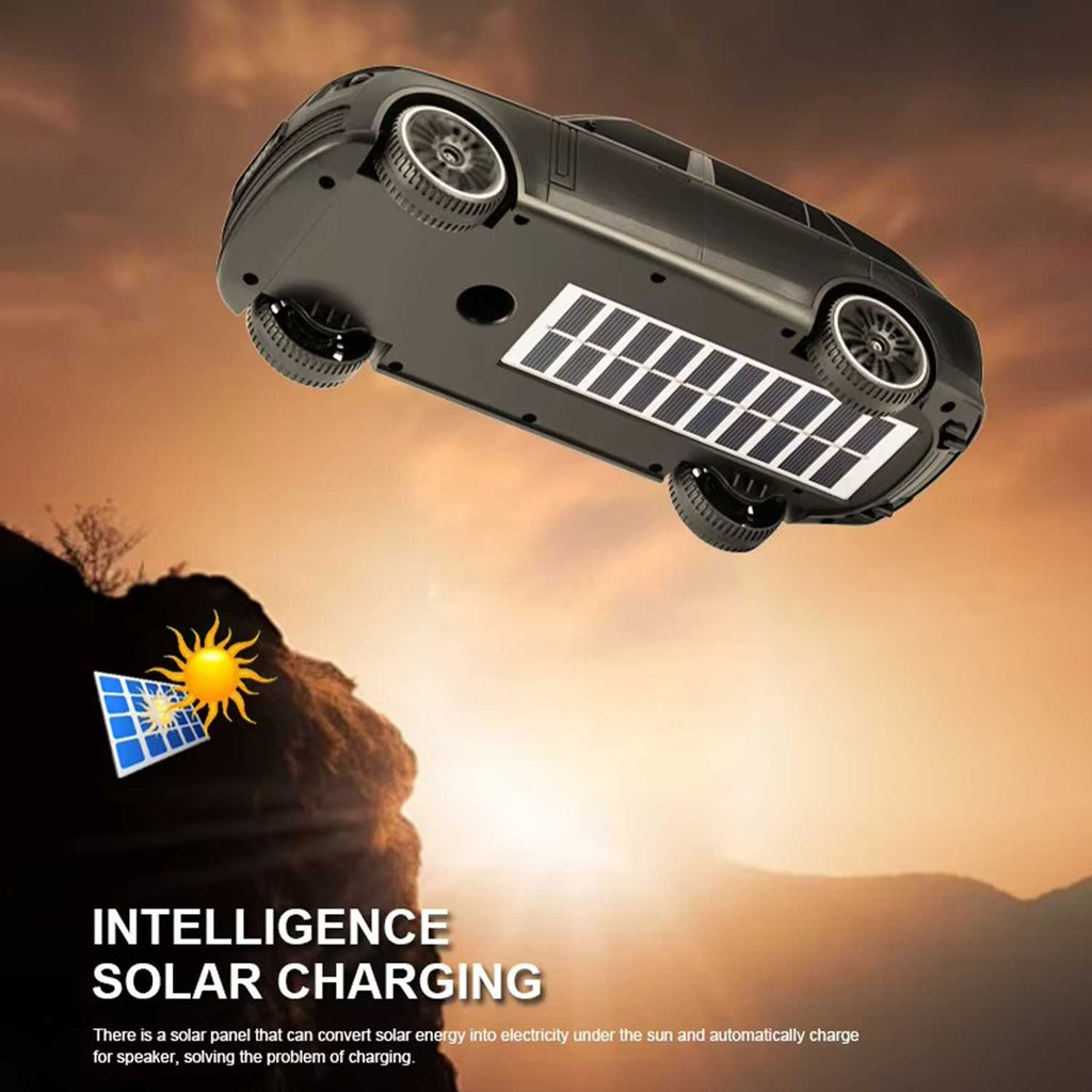 Toy car with solar panel on a mountain background with sunset