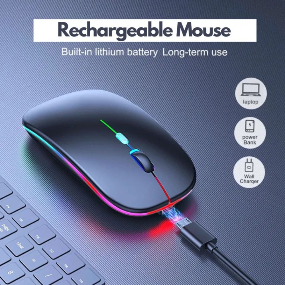 A rechargeable wireless mouse with a glossy black finish and RGB rainbow lighting, shown plugged into a wall charger on a textured gray desk next to a keyboard. Text at the top reads 'Rechargeable Mouse' with icons on the right indicating use with laptops, power bank, and wall charger.