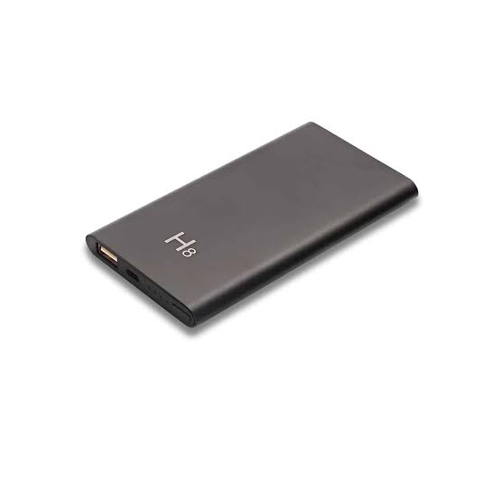 H8 HD 1080P night vision hidden WiFi power bank camera resting on a wooden desk