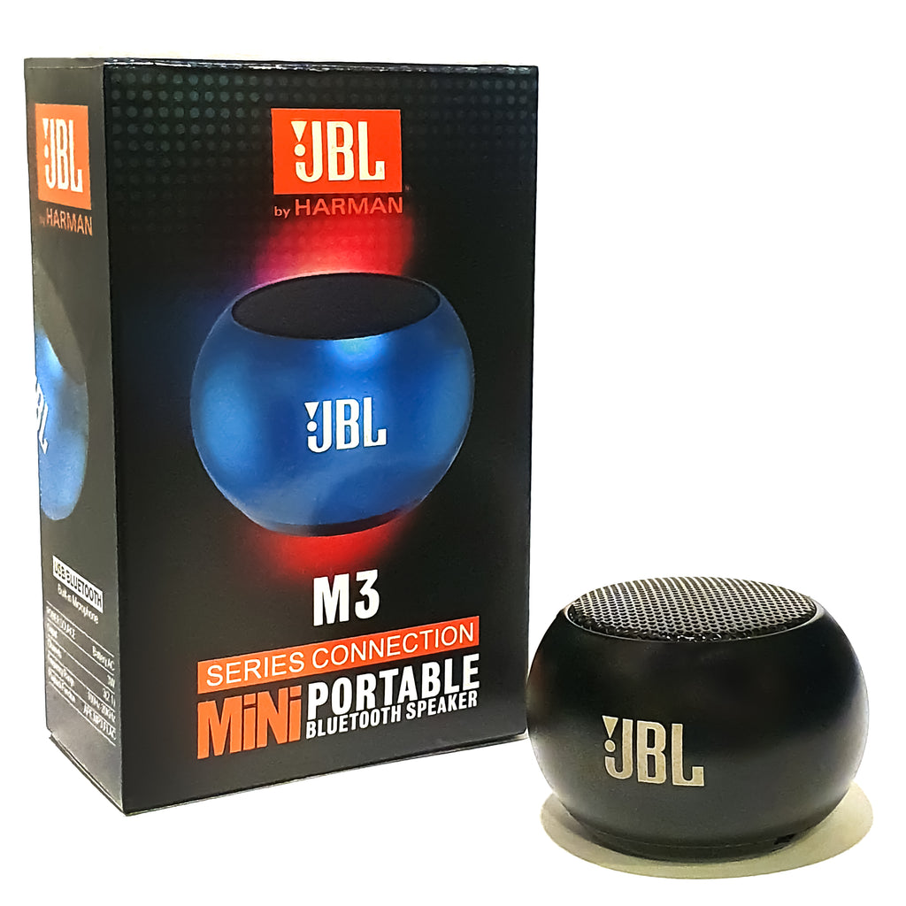 JBL M3 Mini portable speaker connected via Bluetooth to a smartphone playing music on a wooden desk